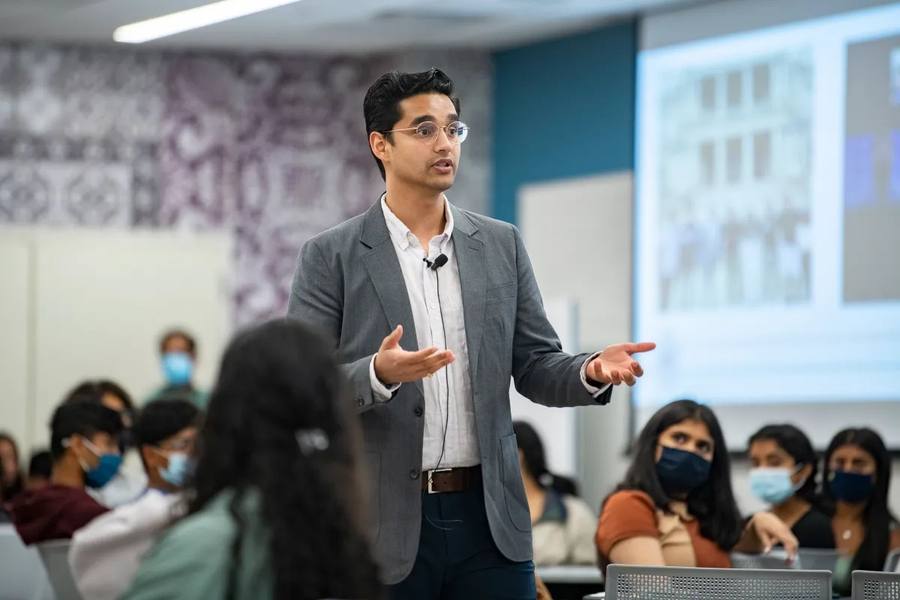 NAAIS founder Sudhanshu Kaushik addressing masked students on campus